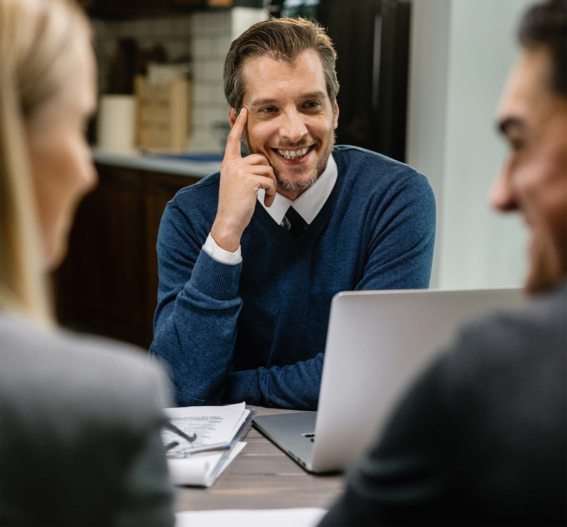 Success & Wellbeing Service Page Executive Therapy & Coaching Offers Telehealth in New York, Massachusetts & Maine image of man smiling with colleagues