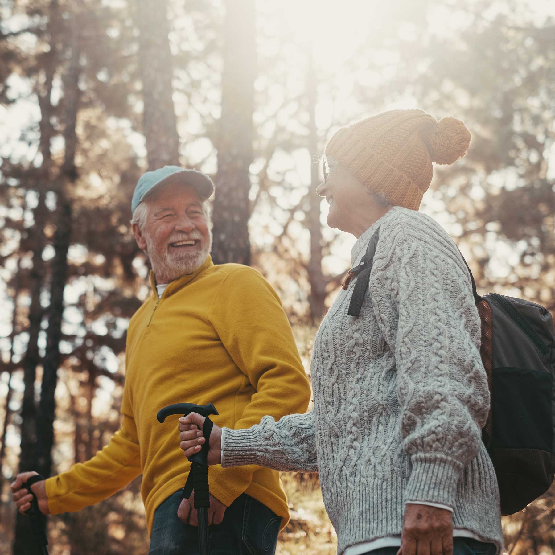 Success & Wellbeing Get In Touch Offers Telehealth in New York, Massachusetts & Maine image of elders walking in the forest smiling