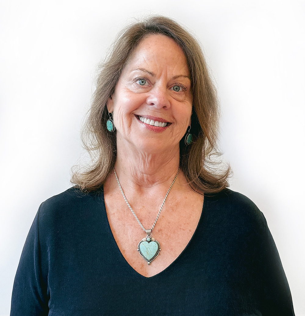 Portrait of Patty Walker, therapist, smiling gently with calm and compassionate presence