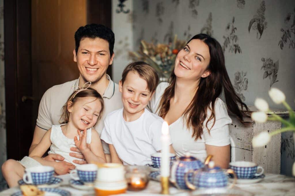 Family sitting together during a supportive family therapy session in a calm home environment