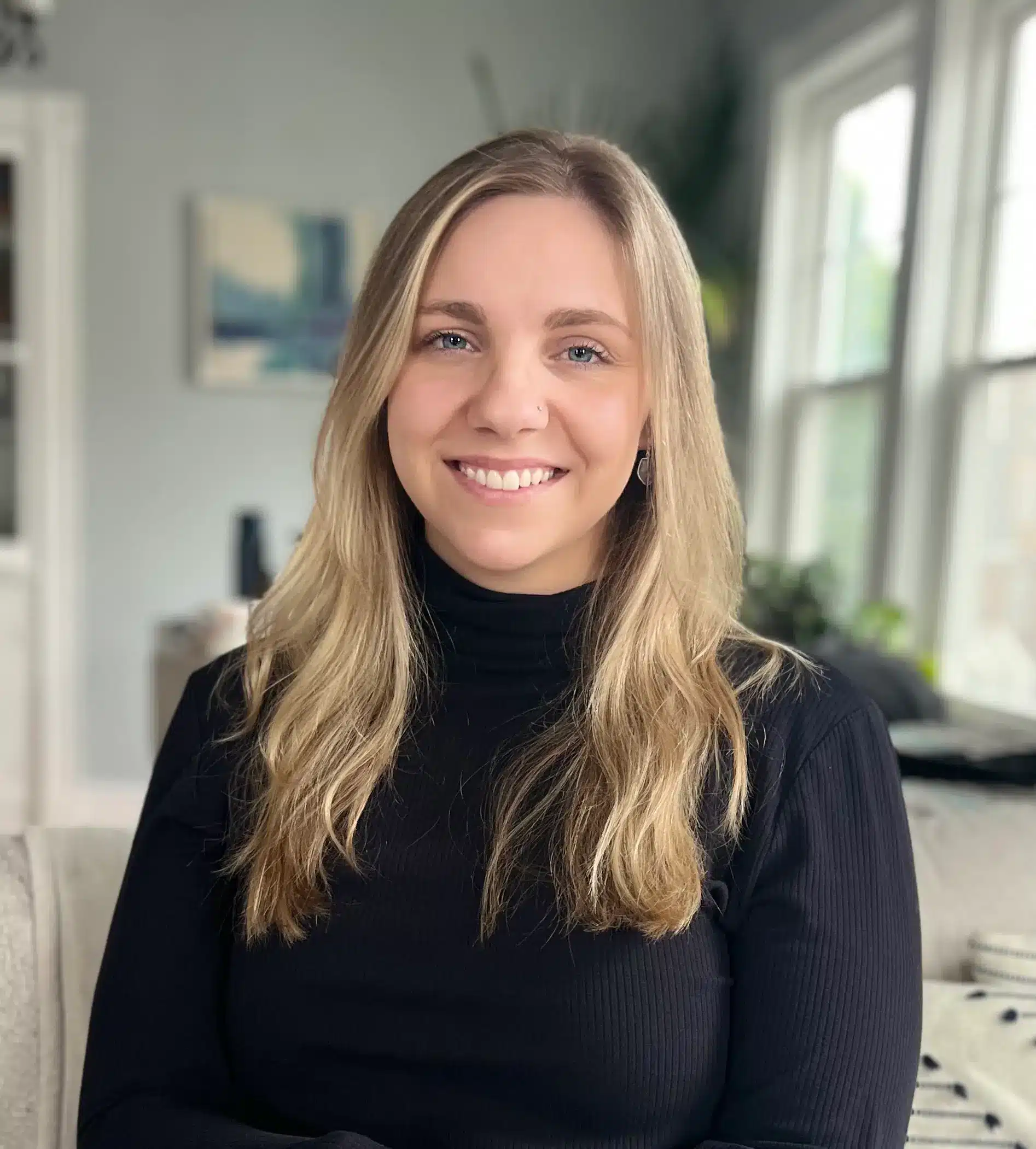 LillieJane Smith is smiling and wearing a black shirt.
