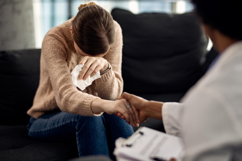 Woman struggling seeking solace from her psychotherapist