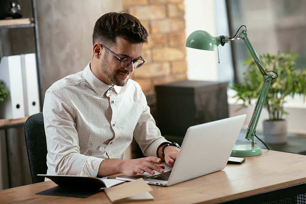 Businessman working on a laptop in an office.