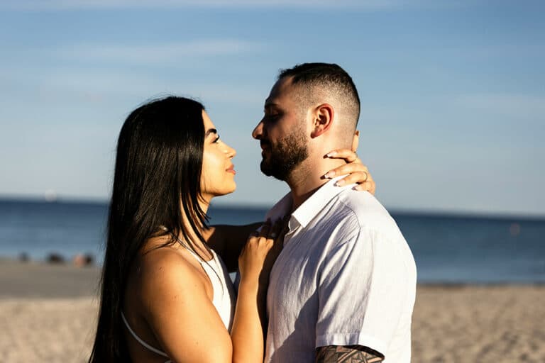 Man and woman standing on a beach
